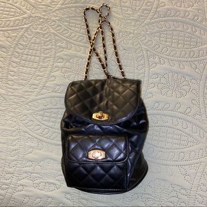 Black quilted mini backpack gold hardware